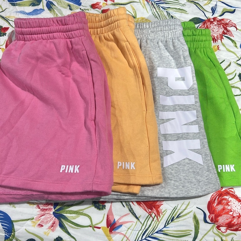 4 pair of Victoria Secret pink shorts. 1 grey..1 pink..1 green..1 orange.